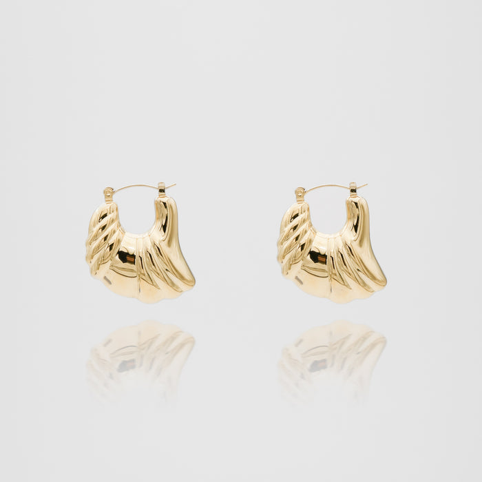 Gold hoop earrings with textured design.