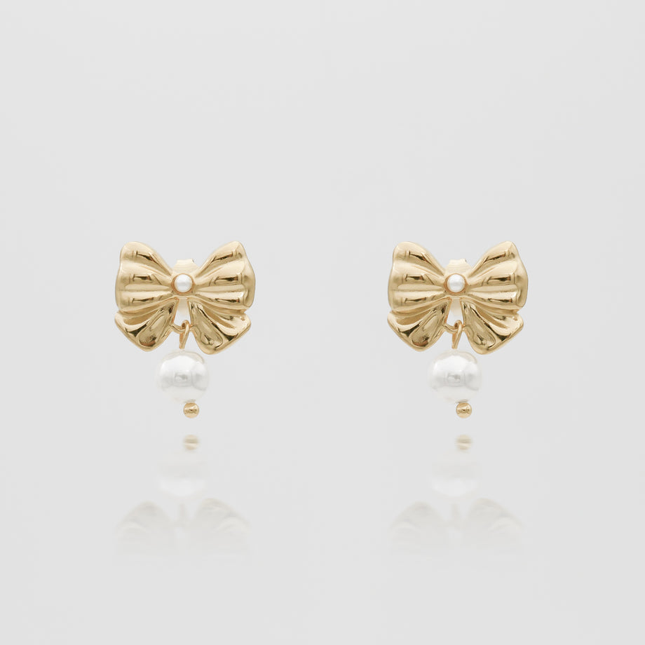 Gold bow earrings with pearls.
