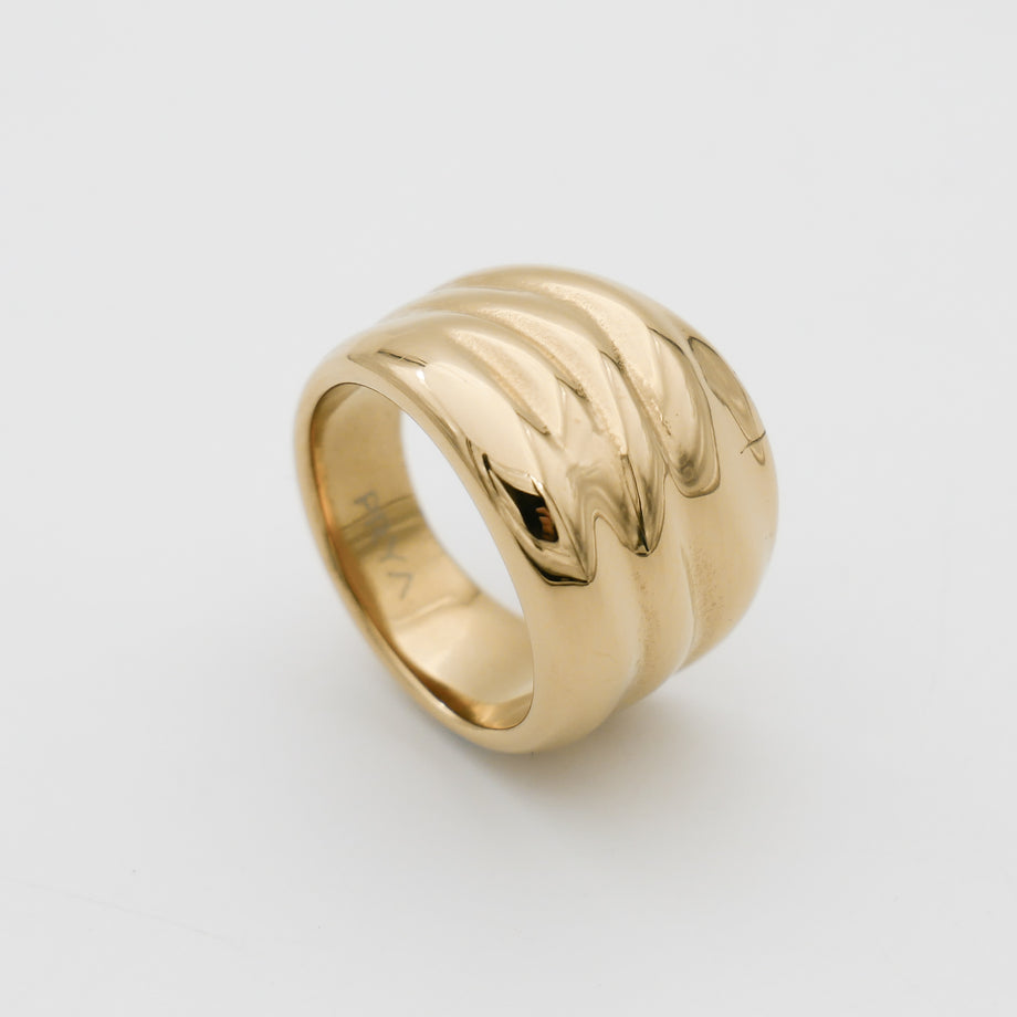 Gold ring with wavy, textured design.