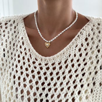 model wearing Pearl heart pendant necklace with 18k plated gold heart pendant from prya