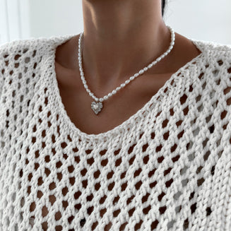 model wearing Pearl heart pendant necklace with silver plated gold heart pendant from prya