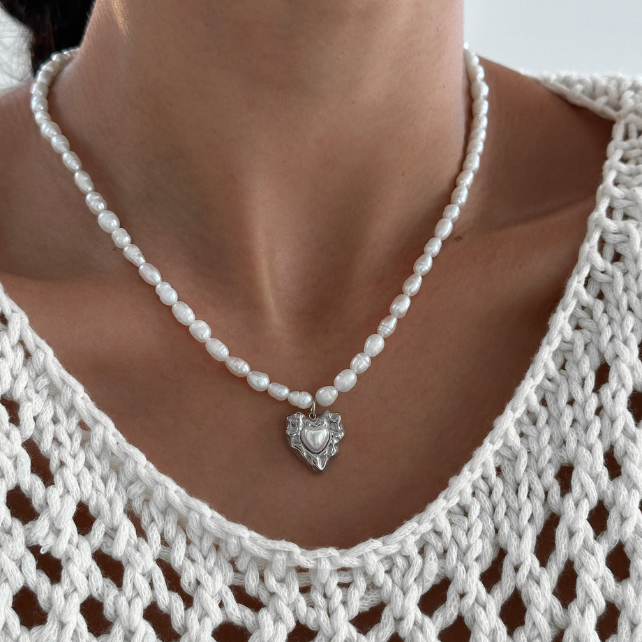 model wearing Pearl heart pendant necklace with silver plated gold heart pendant from prya