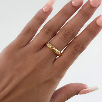 model wearing Astrid Ring, a Gold plated band with a unique sea urchin texture from prya