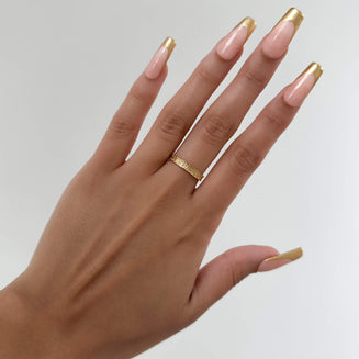 model wearing Aurora Ring is a dainty Gold plated ring featuring intricate heart geometric patterns inspired by Celtic designs