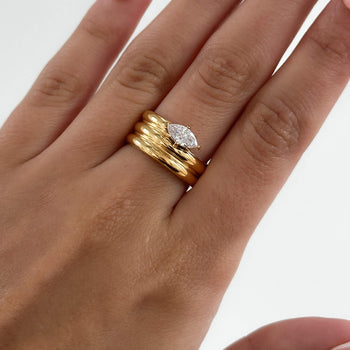 model wearing Emilia Ring is a bold, chunky gold plated ring inspired by retro style. Featuring a dazzling CZ centre stone from prya