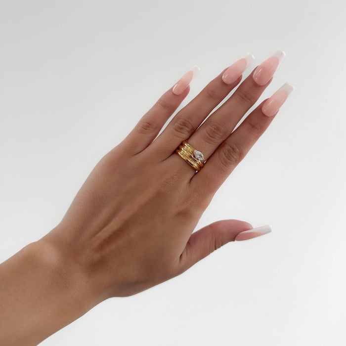 model wearing Emilia Ring is a bold, chunky gold plated ring inspired by retro style. Featuring a dazzling CZ centre stone from prya