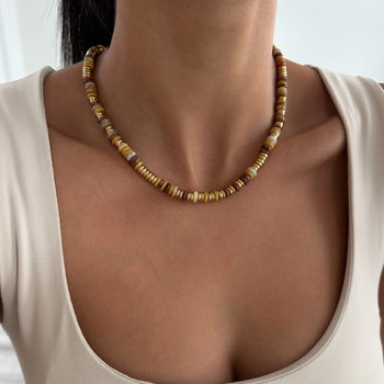 model wearing Harmony Necklace, crafted in 18k Gold plated stainless steel and adorned with natural stones from Prya