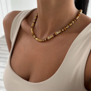 model wearing Harmony Necklace, crafted in 18k Gold plated stainless steel and adorned with natural stones from Prya