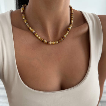 model wearing Harmony Necklace, crafted in 18k Gold plated stainless steel and adorned with natural stones from Prya