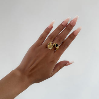 model wearing 18K plated gold abstract ring from prya