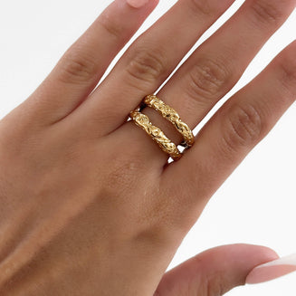 model wearing Luciana Ring featuring a double-layered Gold plated band with a unique hammered, sea urchin texture from Prya