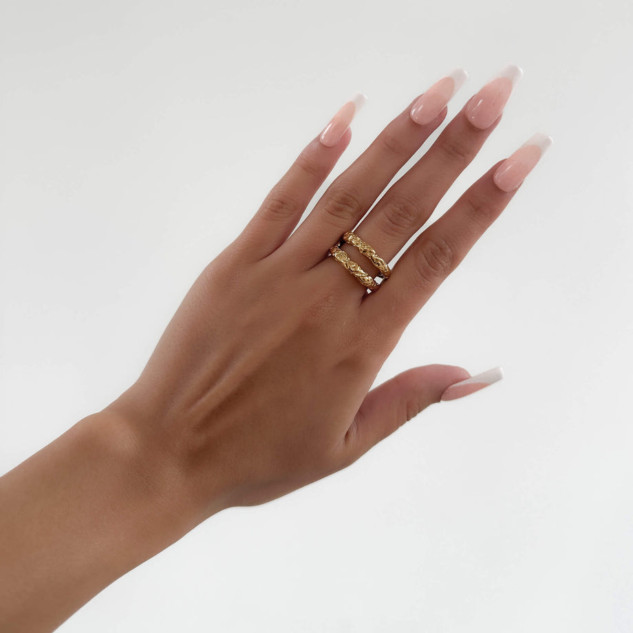 model wearing Luciana Ring featuring a double-layered Gold plated band with a unique hammered, sea urchin texture from Prya