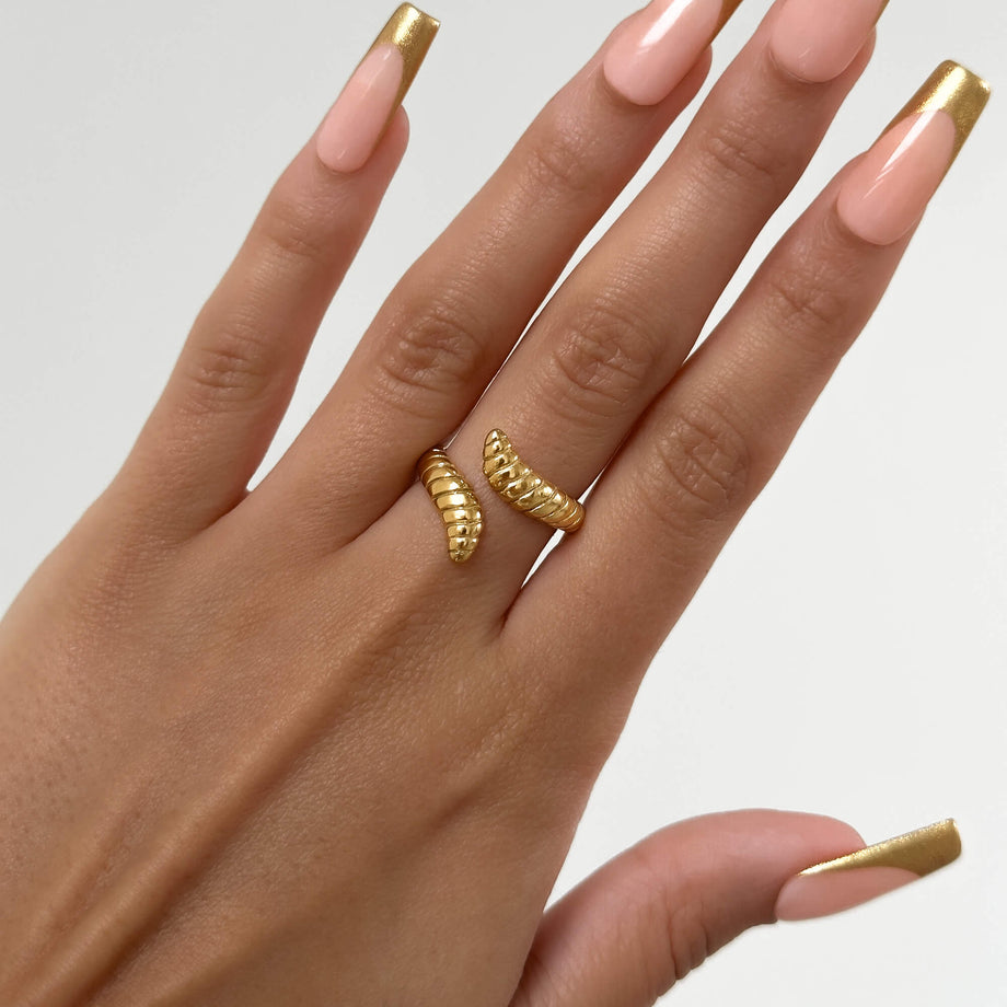 model wearing Meera Serpentine Gold plated ring with an elegant snake design with intricate grooves made by Prya