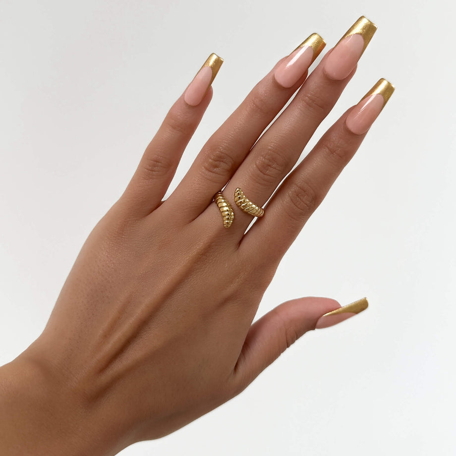 model wearing Meera Serpentine Gold plated ring with an elegant snake design with intricate grooves made by Prya