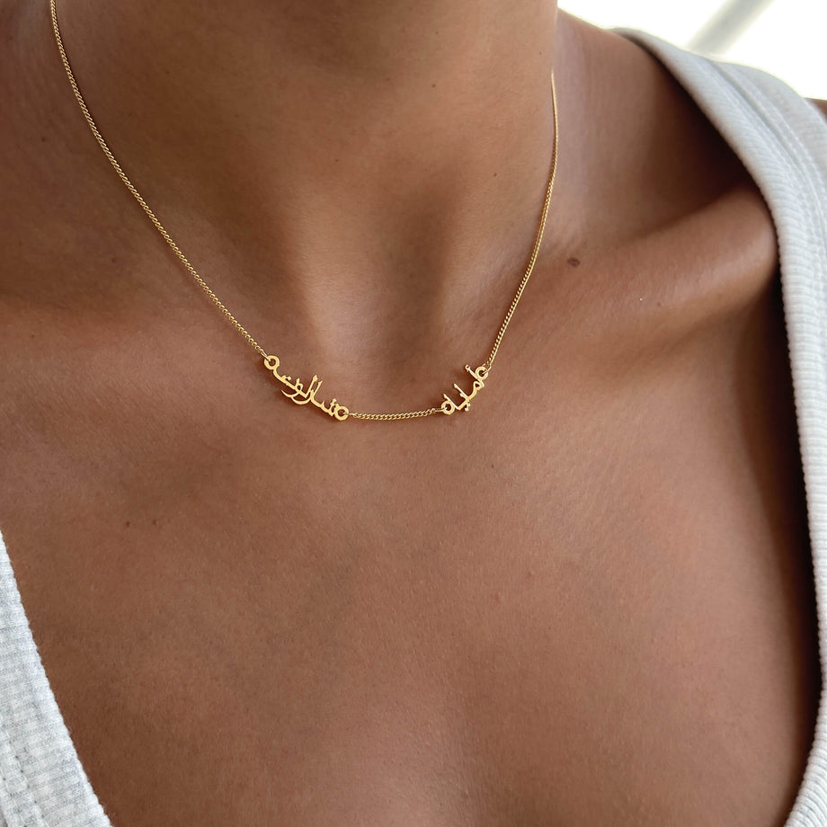 model wearing personalised arabic multiple name necklace, up to four names available in gold, rose gold and silver plated from prya