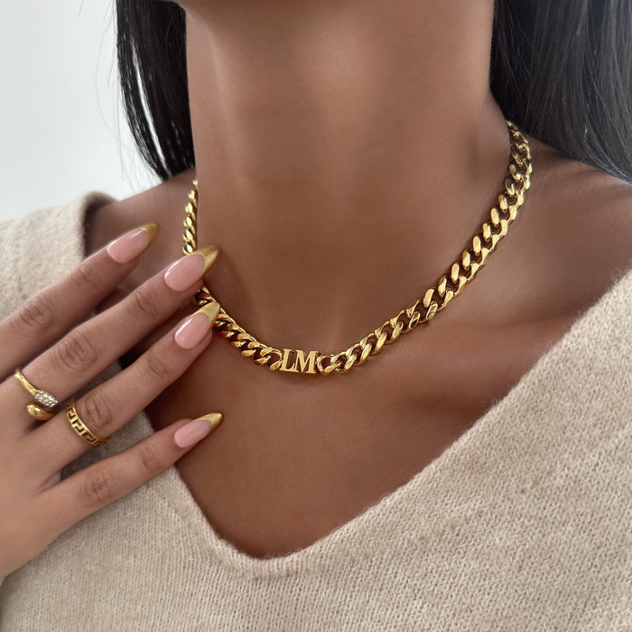 Model wearing Initial choker necklace in gold