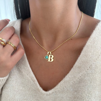 Model wearing Gold initial birthstone necklace 