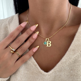 Model wearing Gold initial birthstone necklace 