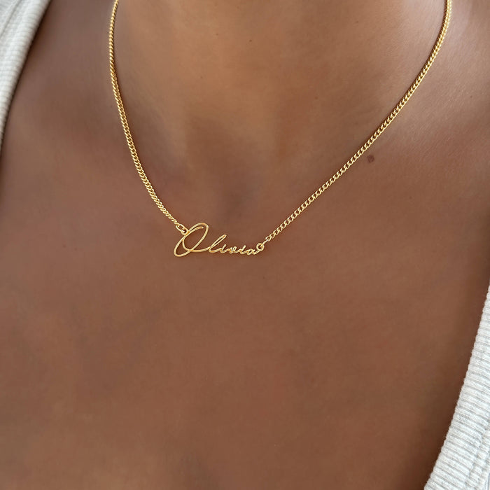 Model wearing Personalised signature name necklace in 18K gold classic link chain made by PRYA UK 