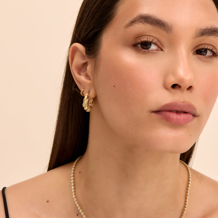 model wearing gia twisted hoop earrings in pave gold from prya