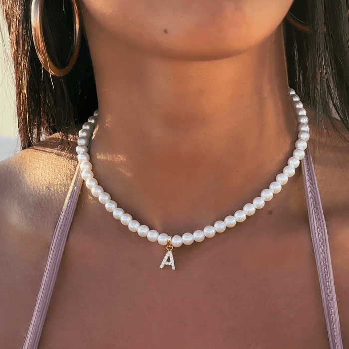 model wearing icy pearl initial necklace from prya