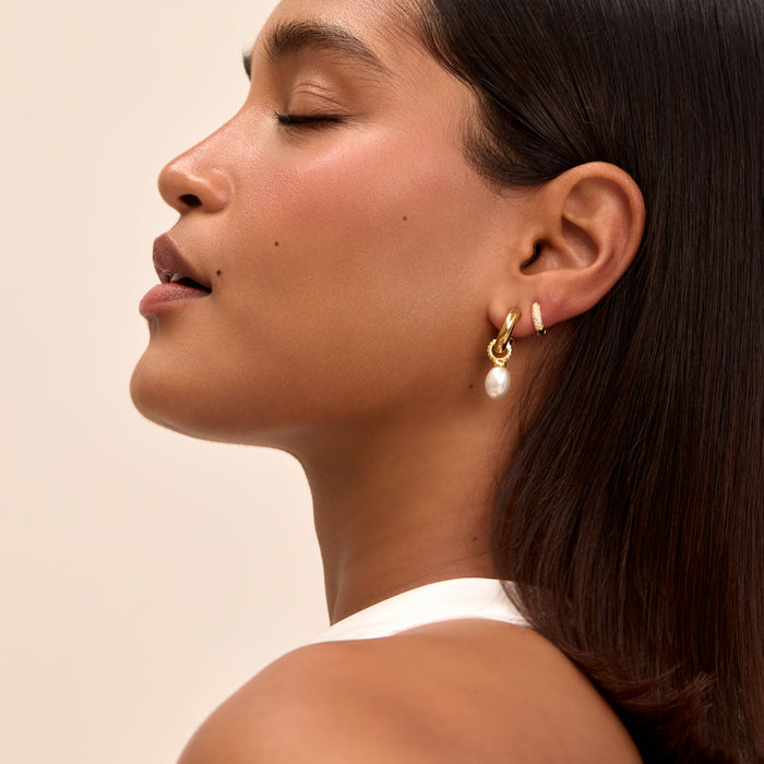 model wearing pave nala pearl earrings in gold from prya