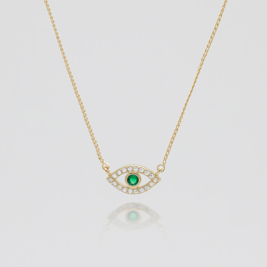 Gold Evil eye necklace paved with CZ and Emerald