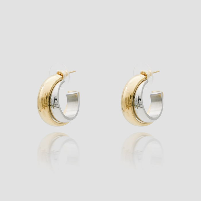 Gold and silver hoop earrings on display.