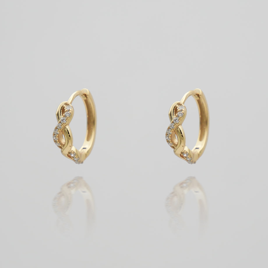 Gold hoop earrings with diamond accents.