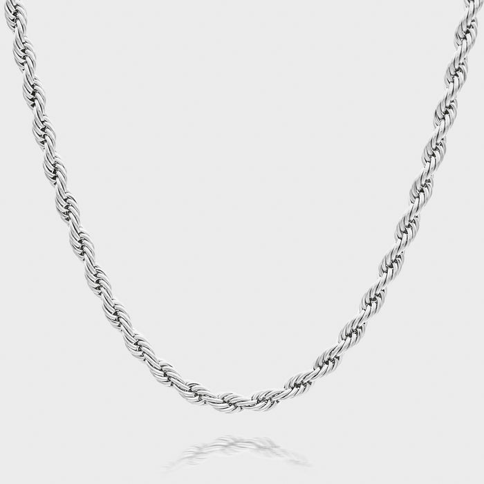 Silver rope chain necklace on white background.