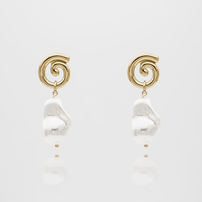 Gold swirl earrings with white pearls.