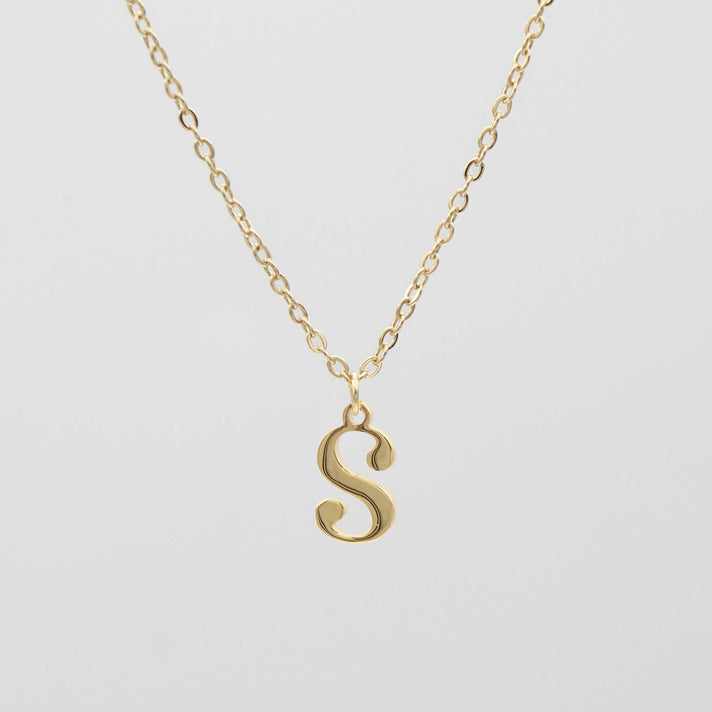 Gold plated initial necklace featuring the letter "S" on a delicate chain, perfect for personalization.