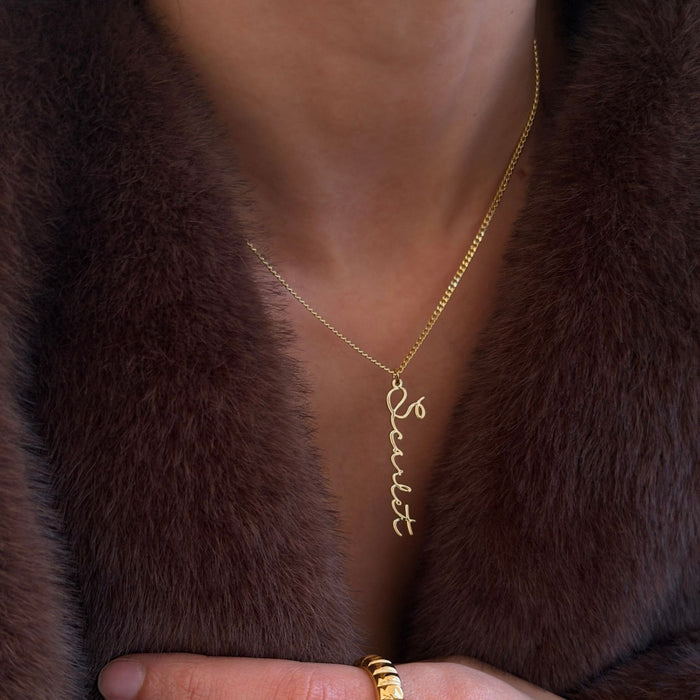 model wearing 18k gold plated vertical  selina custom name necklace 