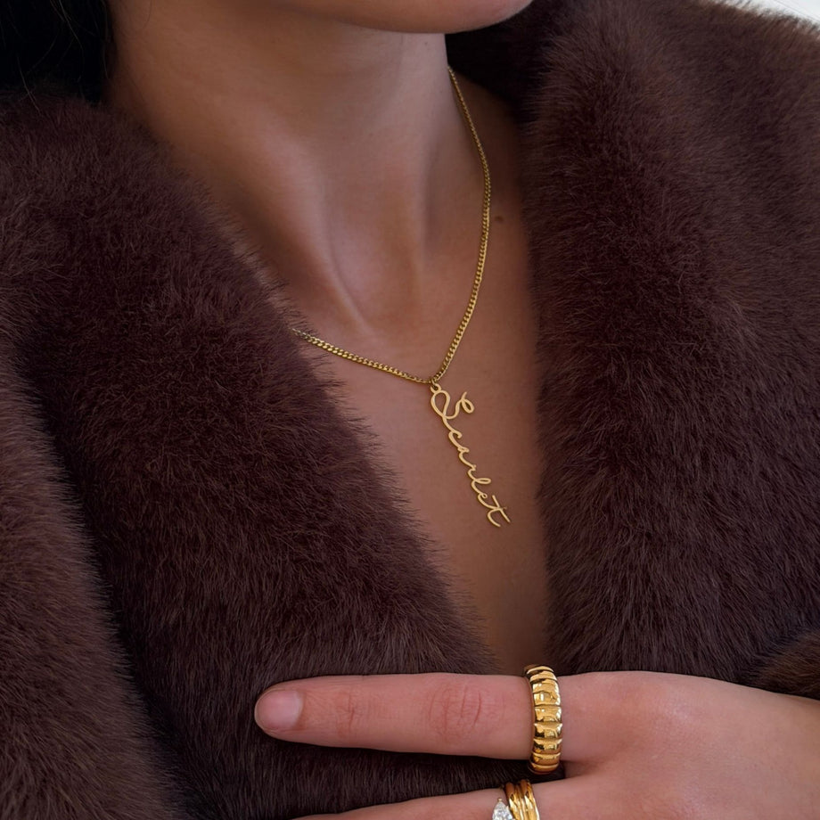 model wearing 18k gold plated vertical  selina custom name necklace 