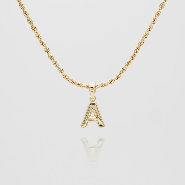 mini bubble initial necklace available in 18k gold or silver plated stainless steel from prya