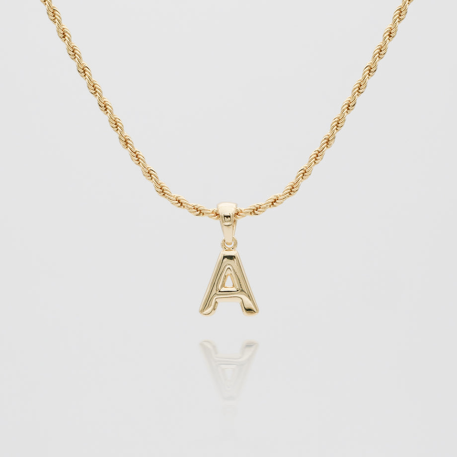 mini bubble initial necklace available in 18k gold or silver plated stainless steel from prya