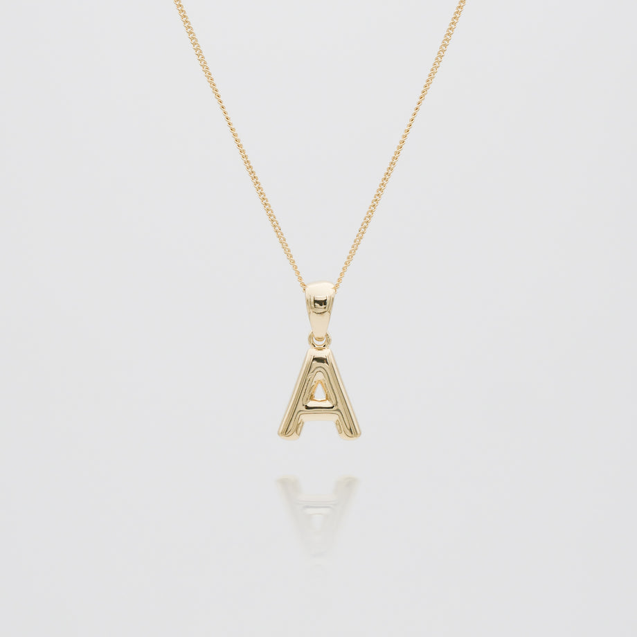 mini bubble initial necklace available in 18k gold or silver plated stainless steel from prya