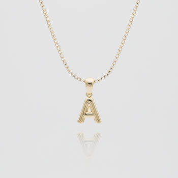 mini bubble initial necklace available in 18k gold or silver plated stainless steel from prya