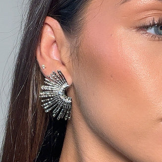 model wearing Solana fan earrings in silver from prya