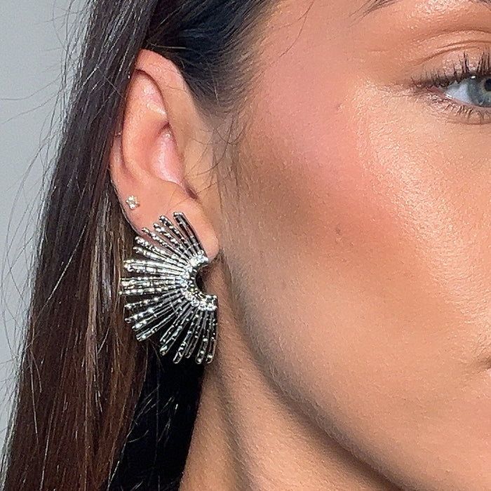 model wearing Solana fan earrings in silver from prya