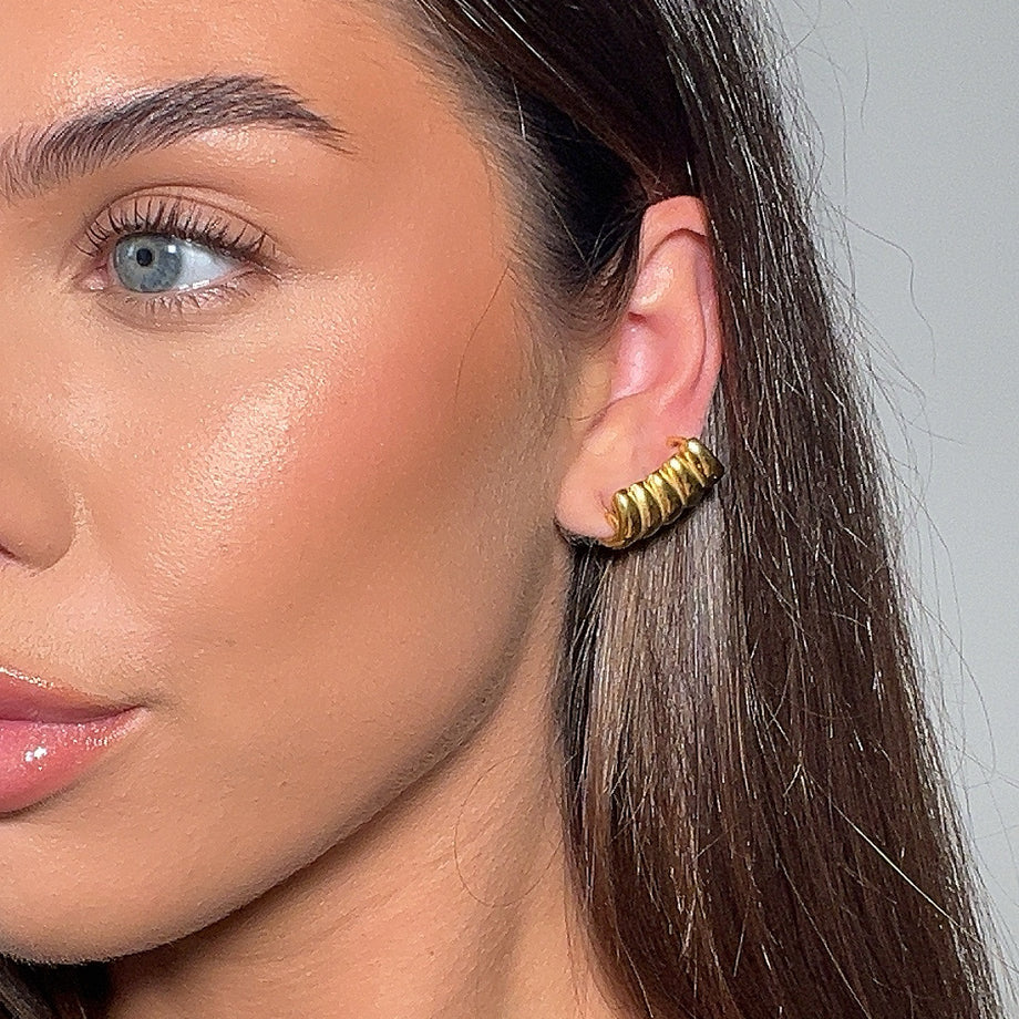 model wearing Tamira Earrings, crafted in 18k plated gold with a scrunched texture from prya