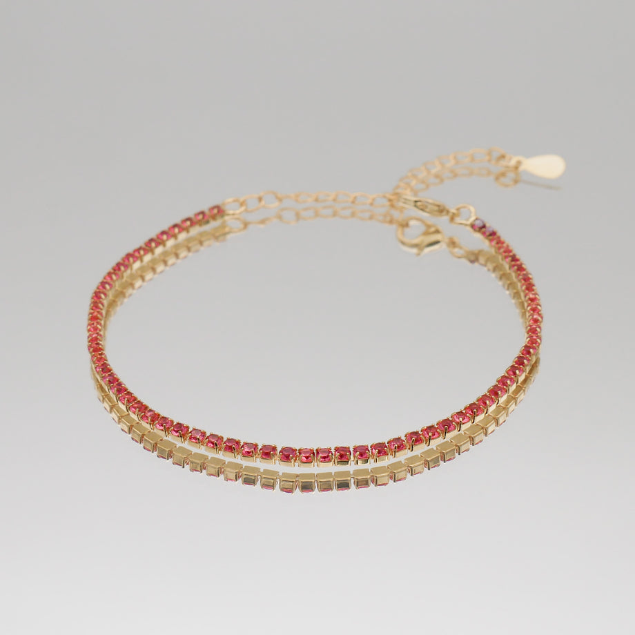 Icy tennnis cz bracelet in gold and pink gemstones