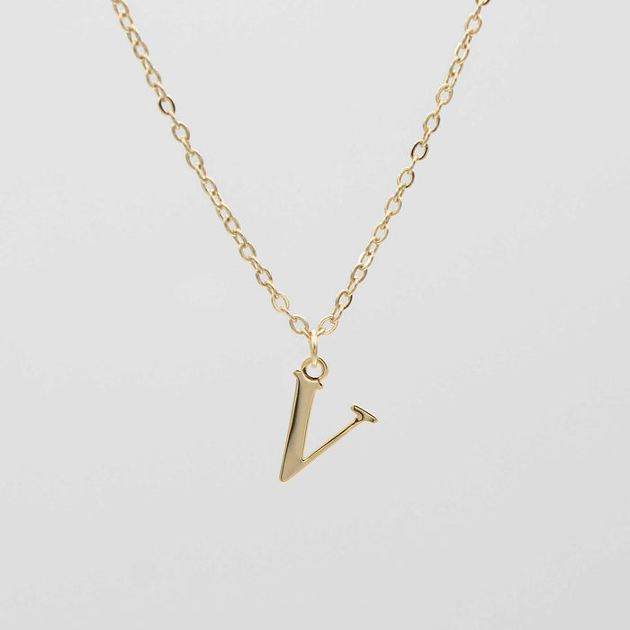 Gold plated initial necklace featuring the letter "V" on a delicate chain, perfect for personalization.