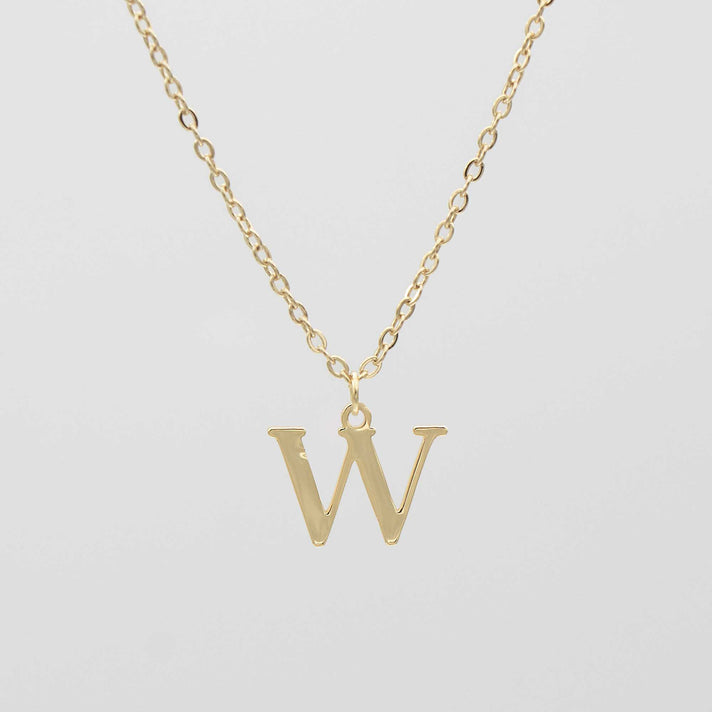 Gold plated initial necklace featuring the letter "W" on a delicate chain, perfect for personalization.