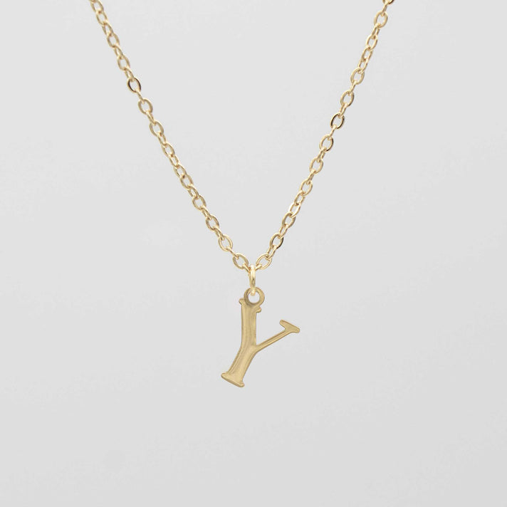 Gold plated initial necklace featuring the letter "Y" on a delicate chain, perfect for personalization.