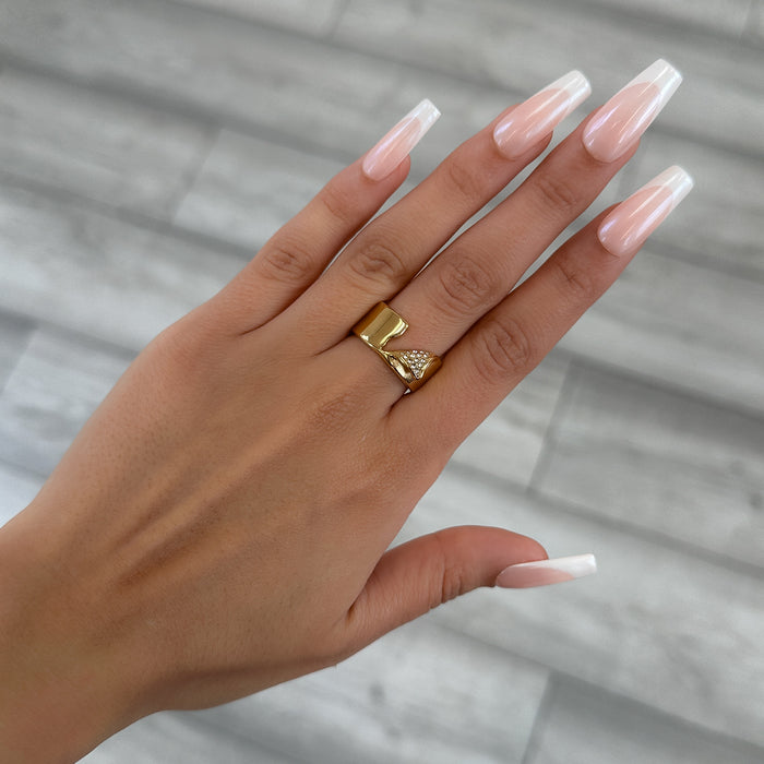 model wearing Zuri Cut-Out asymmetrical Band Ring, enhanced with shimmering CZ, crafted from 18k gold plated stainless steel from prya