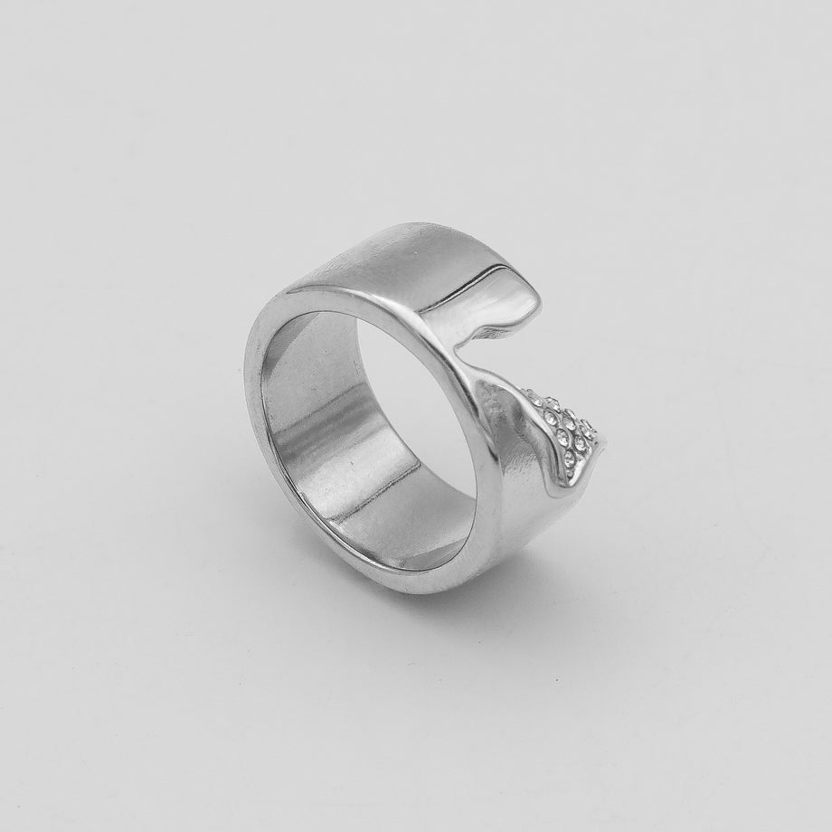 Zuri Cut-Out asymmetrical Band Ring, enhanced with shimmering CZ, crafted from silver plated stainless steel from prya