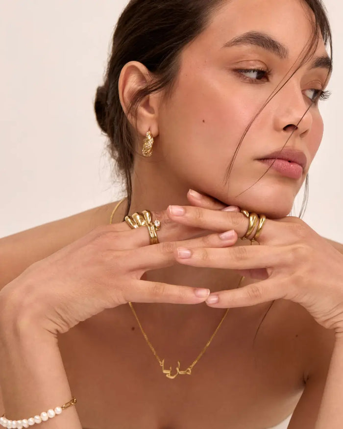 model wearing 18k gold plated jewellery, rings, earrings, necklaces and bracelets from prya