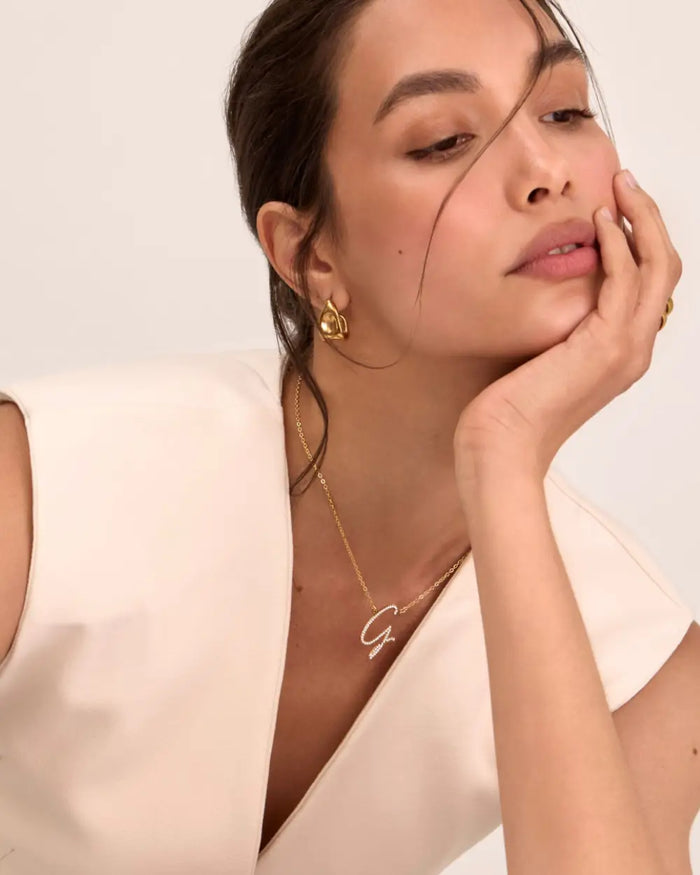 image of model wearing initial icy jewellery in gold from prya