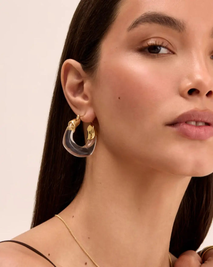 model wearing celine clear gold earrings from prya 
